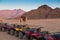 ATVsÂ  and lonely camel in the desert . Sinai. Egypt.